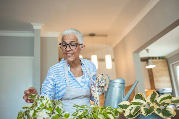 istock Active senior woman enjoying planting. 1277622152