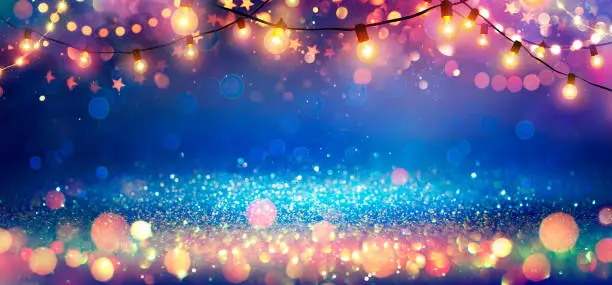 Photo of Abstract Christmas Party Background - Golden Glitter With Defocused Effect In Shiny Night And Bulb-lights