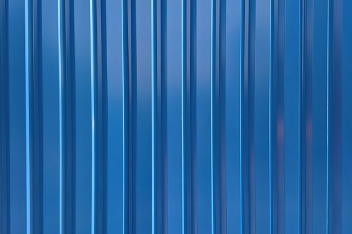 Blue metal corrugated wall, texture and pattern. High quality photo.