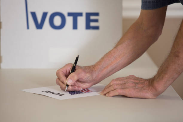 istock Voters at Polling Place 1277626406