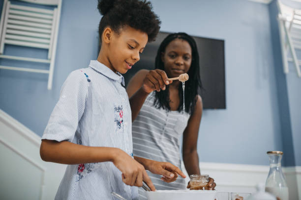 istock African american mom and daughter having fun in the kitchen 1277626608