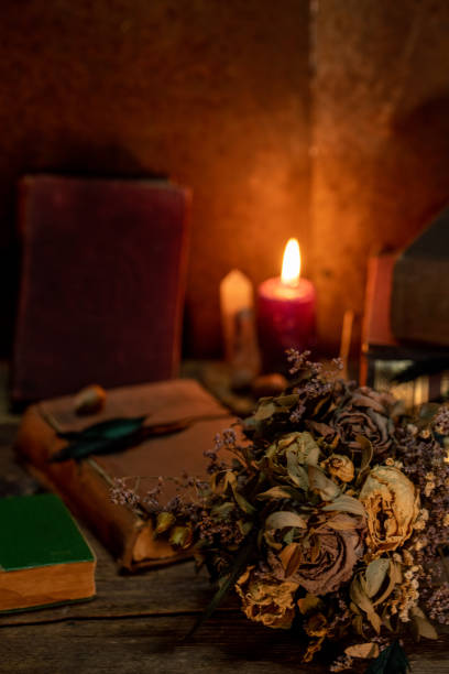 istock Scarry table, with candle and dry flowers, vertical photo. 1277627716