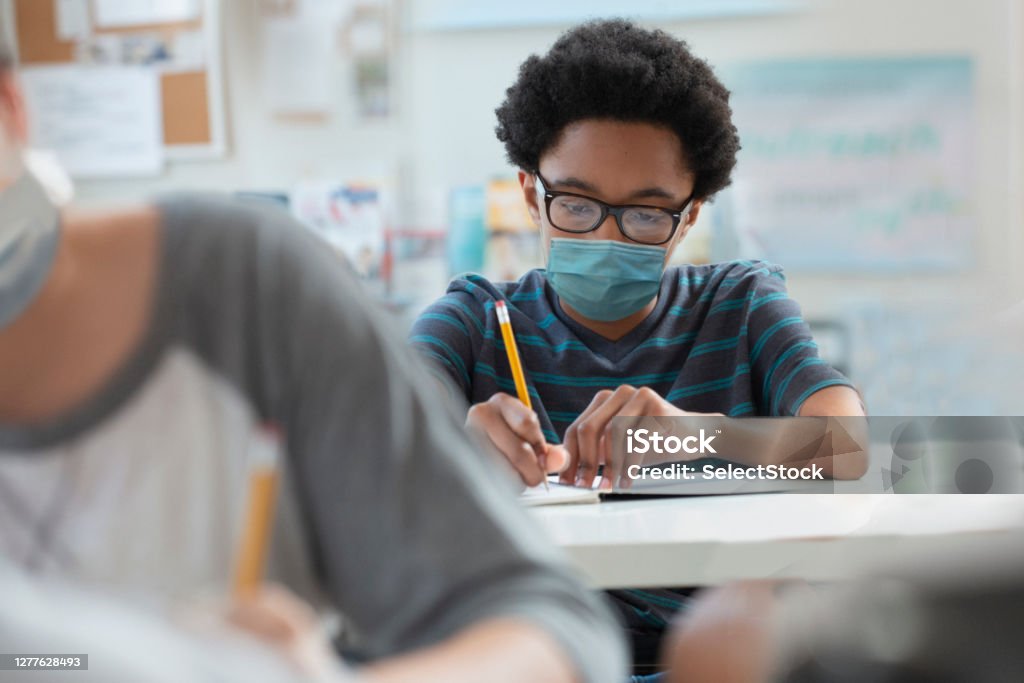 Student back to school wearing mask covid 19 Protective Face Mask Stock Photo