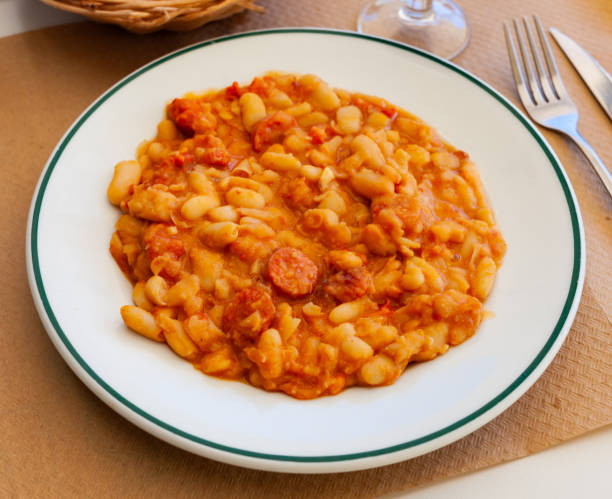 istock Appetizing braised beans with chorizo sausage pieces 1277628531
