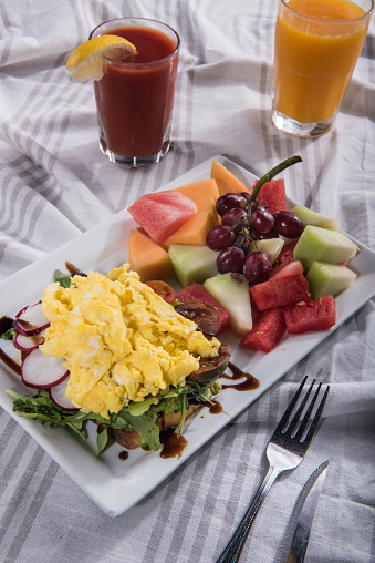 Multigrain toast with scrambled egg and fruit salad  (Click for more)