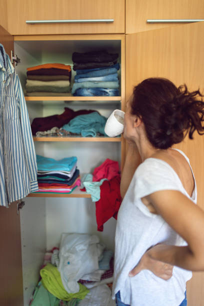 istock A woman arranging the closet 1277636620