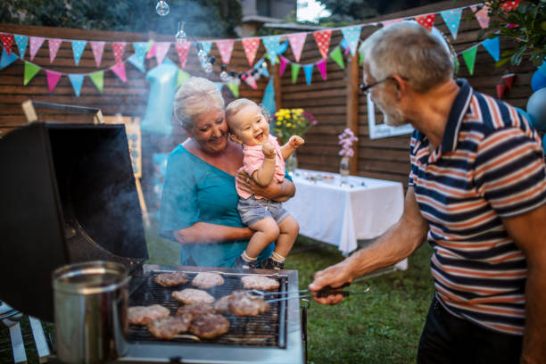 istock Grandfather grilling meat for a barbecue party 1277638134