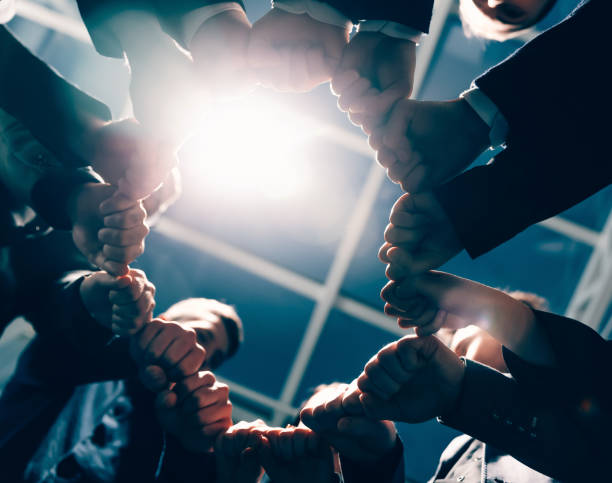 istock close up. ambitious young business people showing their unity 1277642325