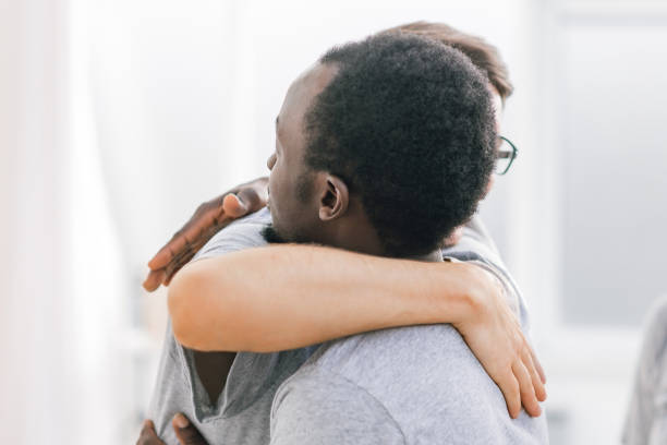 istock two happy student friends hugging each other 1277644900