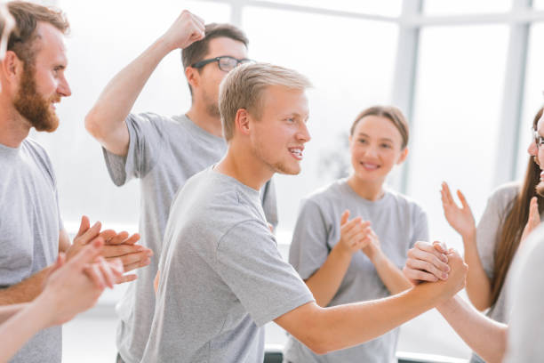 istock group of happy students applauding the contestants 1277644926