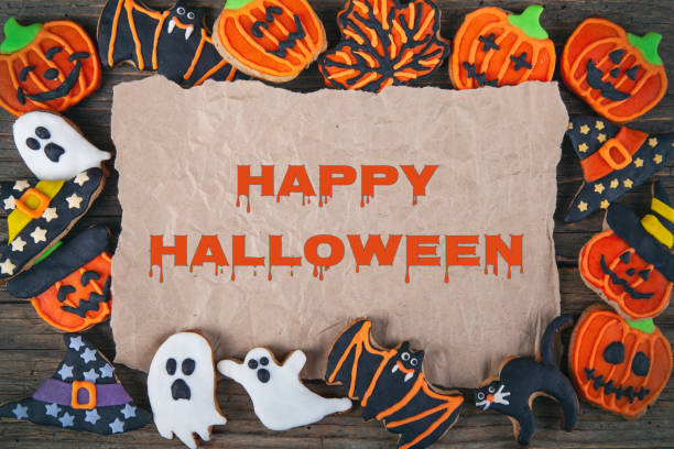 istock Fresh Halloween gingerbread cookies on brown wooden table 1277648023