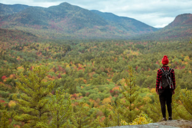 istock Female hiker surrounded by beautiful fall colors 1277648612