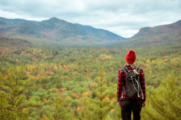 istock Female hiker surrounded by beautiful fall colors 1277648655