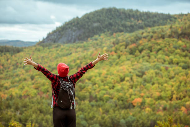 istock Female hiker surrounded by beautiful fall colors 1277649212