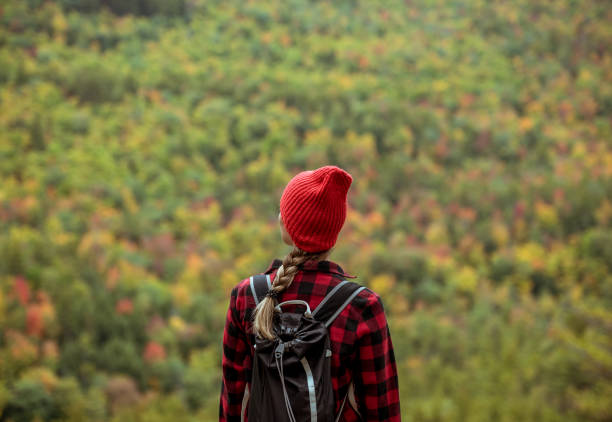 istock Female hiker surrounded by beautiful fall colors 1277649760