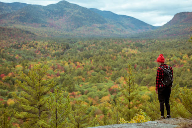 istock Female hiker surrounded by beautiful fall colors 1277649798