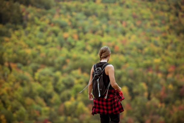 istock Female hiker surrounded by beautiful fall colors 1277649801