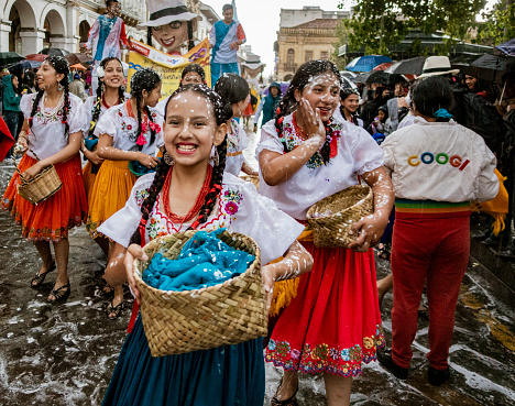 Cuenca, Ecuador, Feb 8, 2018: Parade goers happy in foam spray in Ecuador