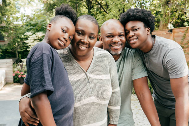 istock Two parents and two kids looking at camera 1277658418