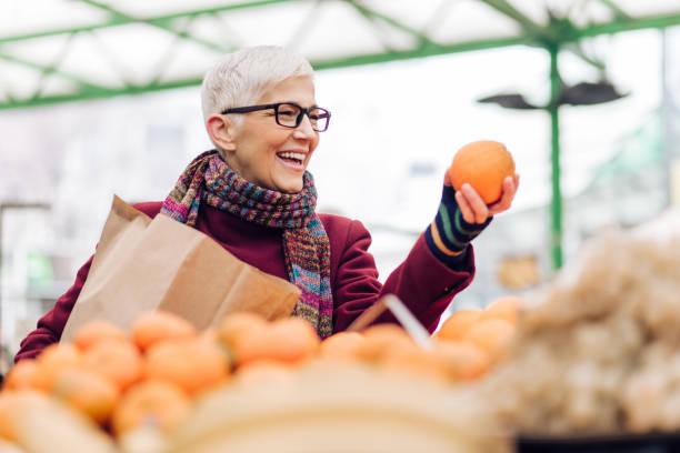 istock Charismatic lady loves oranges 1277658583