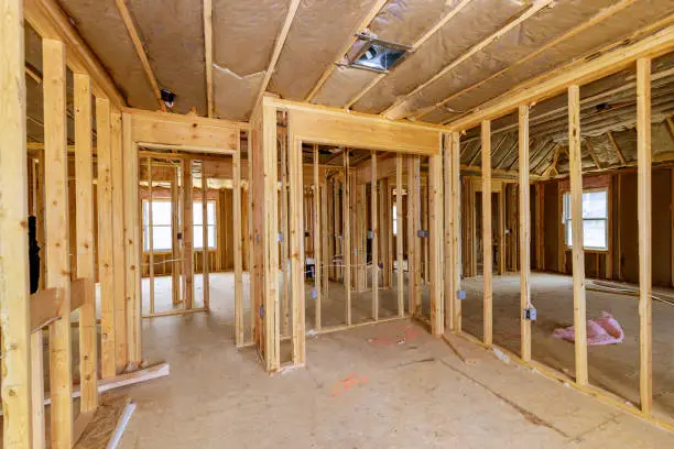 Construction home interior inside a framing on residential beam framework wooden new house