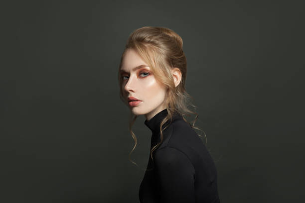 istock Pretty model on black background, portrait 1277665440
