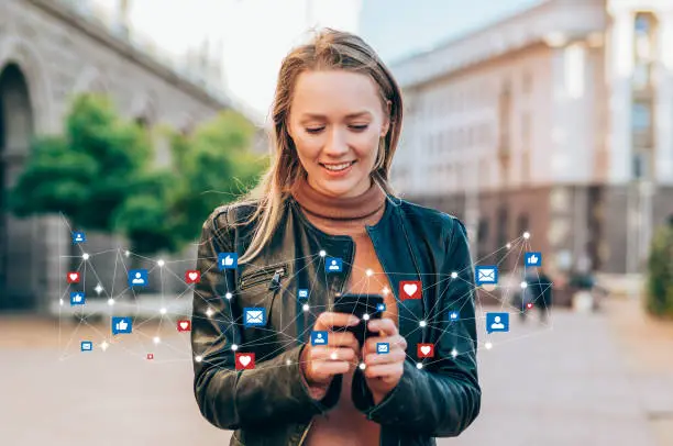 Shot of a beautiful young woman receives notifications on smart phone. Social media and digital online concept. Social media and people network technology concept.