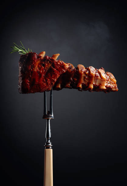 istock Grilled pork ribs with rosemary on a fork. 1277665997