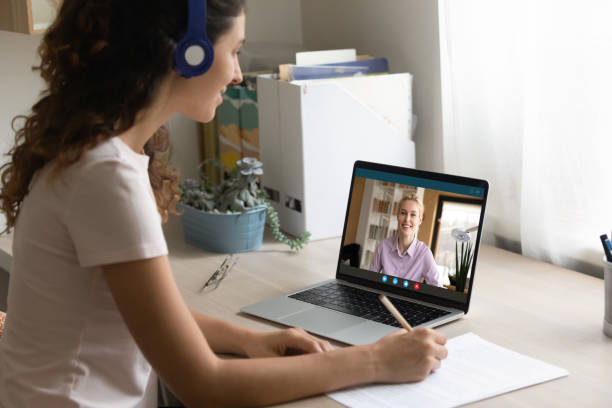 istock Smiling woman have online webcam lesson with teacher 1277668202