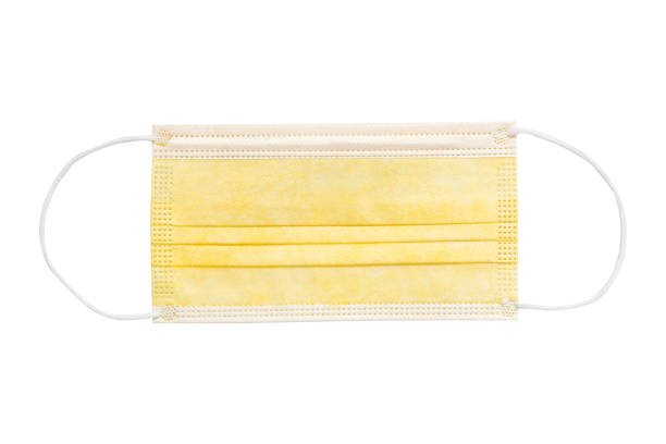 istock yellow medical surgical face mask isolated on white background 1277676227
