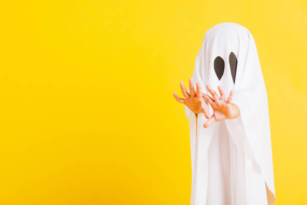 istock little cute child with white dressed costume halloween ghost scary 1277676681
