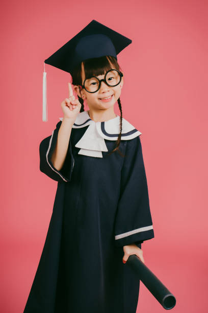 Little Asian Girl Graduation Studio Portrait stock photo