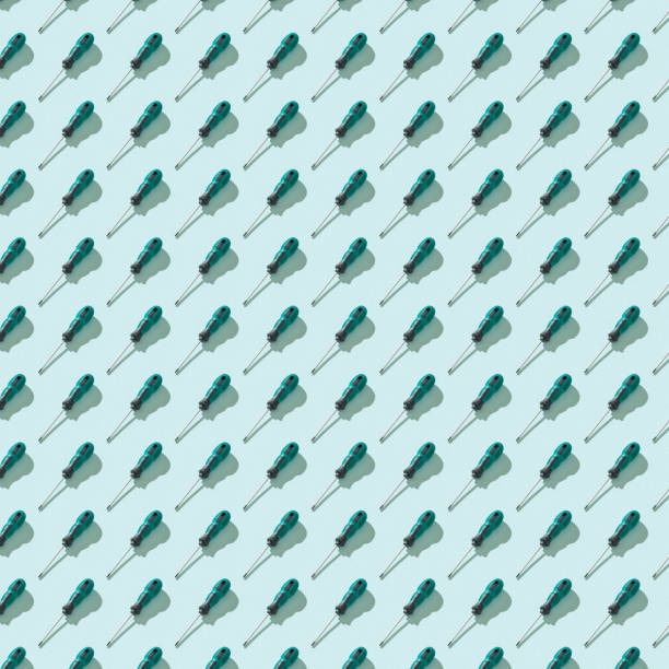 istock Hand screwdrivers with a green and black handle on a blue background. 1277680576