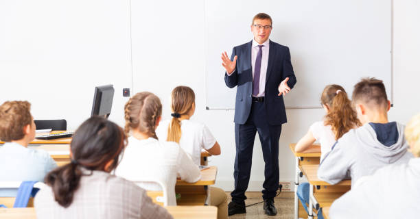 istock Adult teacher is giving lecture for students in class 1277681733