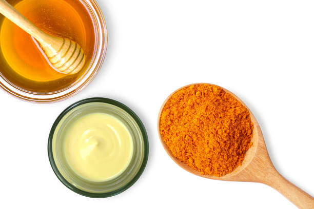 istock Turmeric cream in glass jar with tumeric powder and honey 1277686681