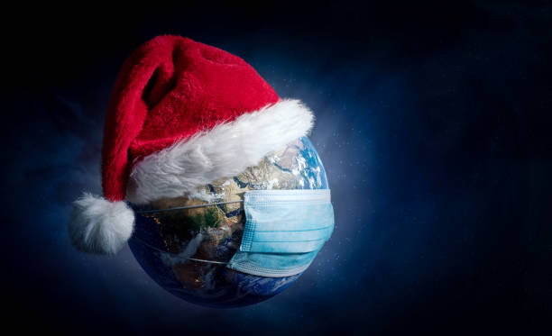 Earth With Surgical Mask and Santa Hat - Virus Infection Covid 19 - World with Coronavirus - Christmas Concept 3D Illustration - Earth map developed from NASA source data on https://visibleearth.nasa.gov/collection/1484/blue-marble tierra con máscara quirúrgica y sombrero de santa - infección por virus covid 19 - mundo con coronavirus - navidad concepto 3d ilustración - mapa de la tierra desarrollado a partir de los datos de origen de la nasa en https://visibleearth.nasa.gov/coll