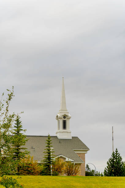 istock Church under cloudy and dark skies in park 1277695154