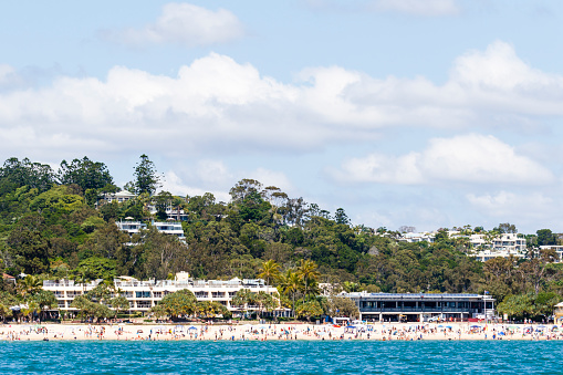 Noosa Heads main beach is a popular and safe place for swimming, sunbathing and ocean activities.