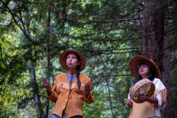 istock First Nations in traditional clothing singing in the cedar forest 1277703723