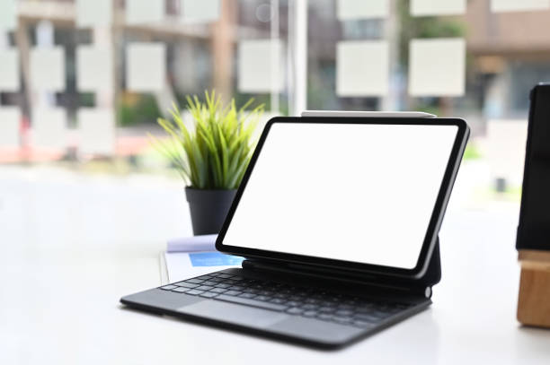 istock Cropped shot of tablet with smart keyboard on white table.Blank screen for graphics display montage. 1277705712