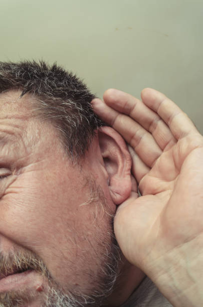 istock Unusual portrait of a man showing eavesdropping. 1277706773