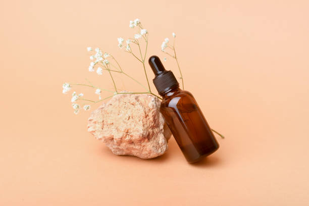 istock A glass bottle stands with aromatic oil on a cube. 1277708052