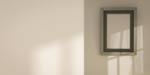 istock vertical blank picture frame. realisitc paper picture-framing mat with wide borders shadow. mockup template on beige wall background with shadows from the window. copy space on the wall. paper texture 1277709230