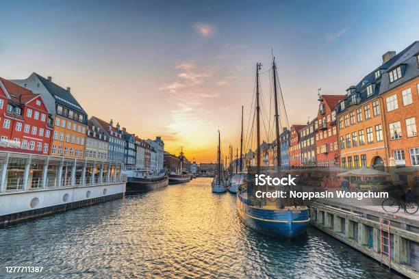 Copenhagen Denmark Sunset City Skyline At Nyhavn Harbour With Colourful House Stock Photo - Download Image Now