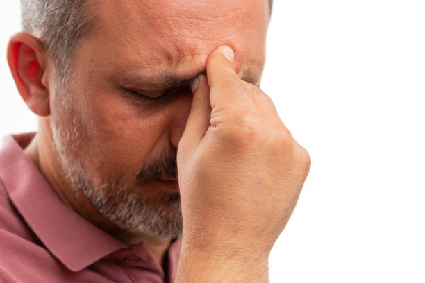 istock Close-up of man touching forehead as stressed thinking gesture 1277712768