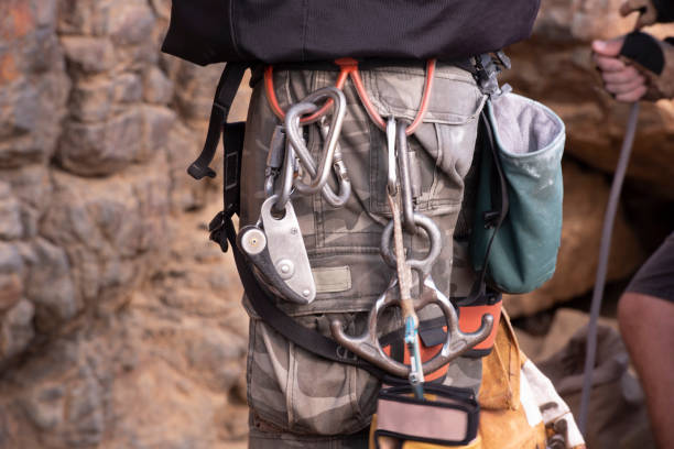 istock Close up on a rock climber wearing a harness. 1277717476