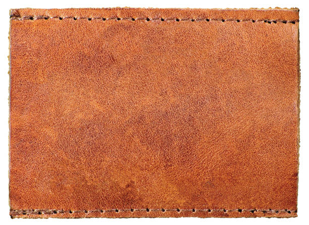 istock Blank Empty Bright Dark Beige, Brown Tan Natural Leather Jeans Label Tag Copy Space Texture, Isolated Textured Pattern Macro Closeup Background 1277717943