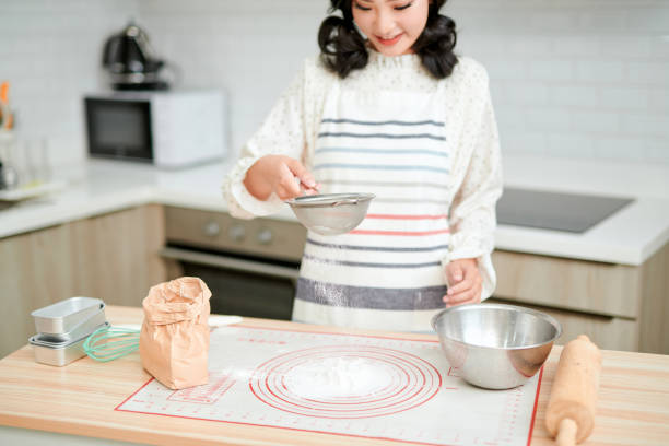 istock Making dough by female hands at bakery 1277719518