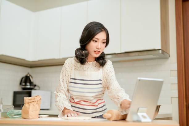 istock A woman in an apron is preparing dough for home baking. 1277719711