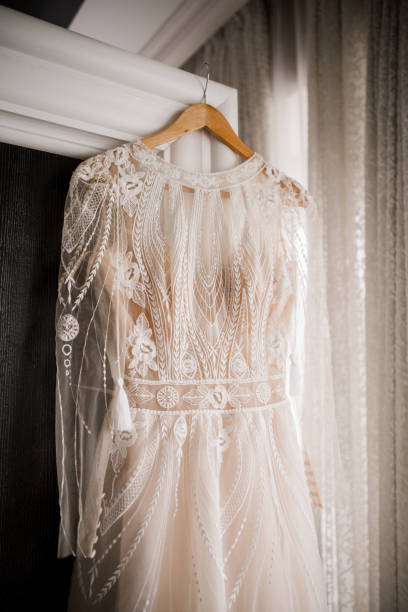 istock the bride's dress hangs on wardrobe on a hanger 1277720012
